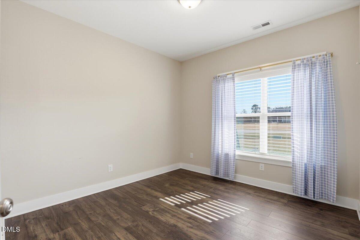 2249 Brogden Road Smithfield, NC 27577 - Photo 25 of 30 a view of wooden floor and windows in a room