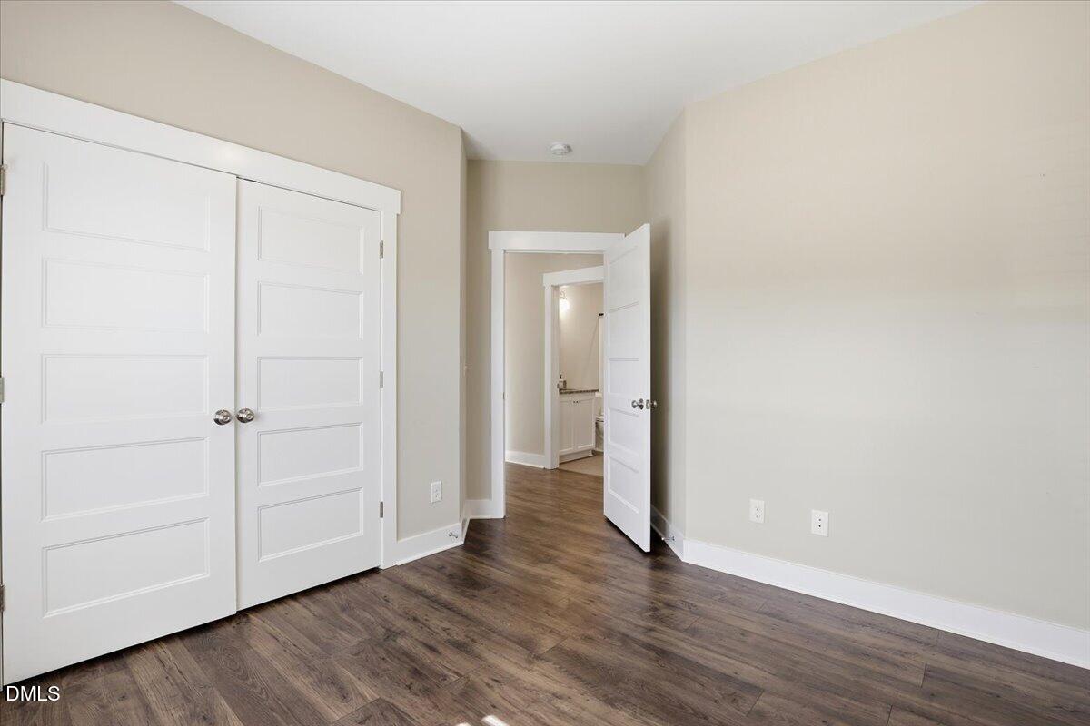 2249 Brogden Road Smithfield, NC 27577 - Photo 26 of 30 a view of an empty room and wooden floor