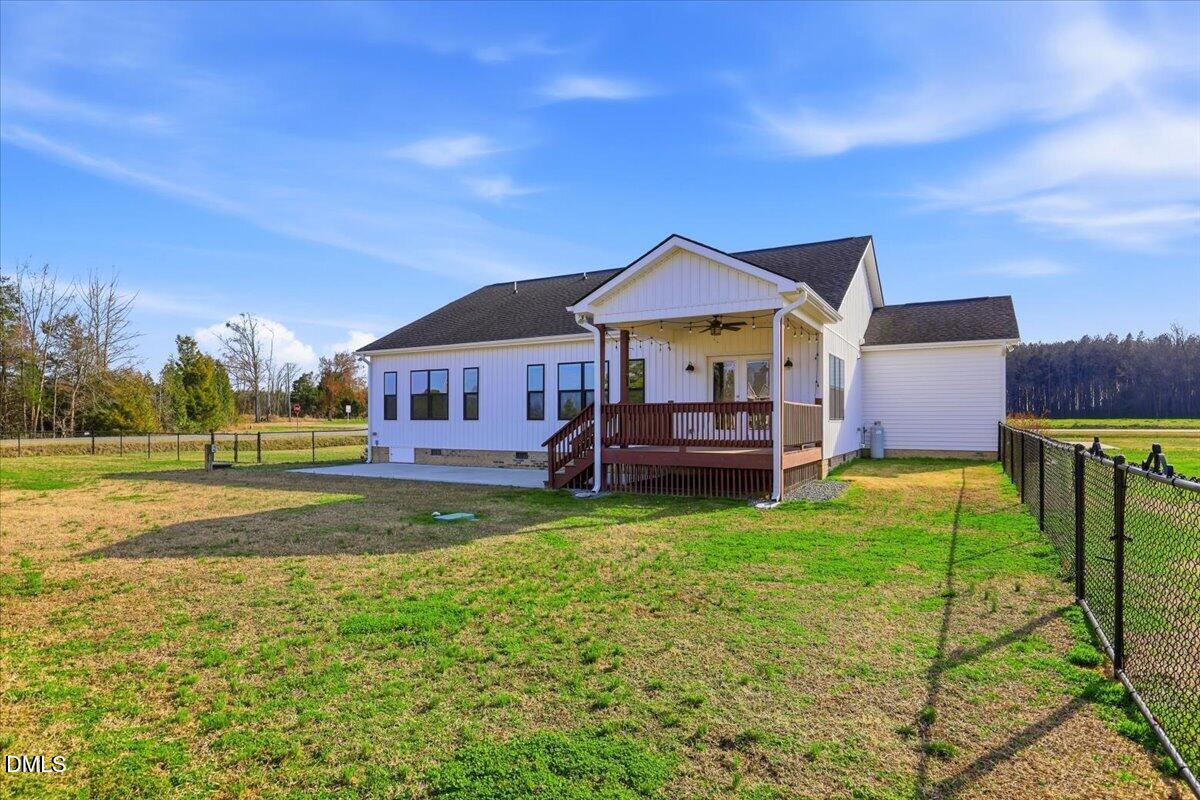 2249 Brogden Road Smithfield, NC 27577 - Photo 27 of 30 a view of a house with backyard and sitting area