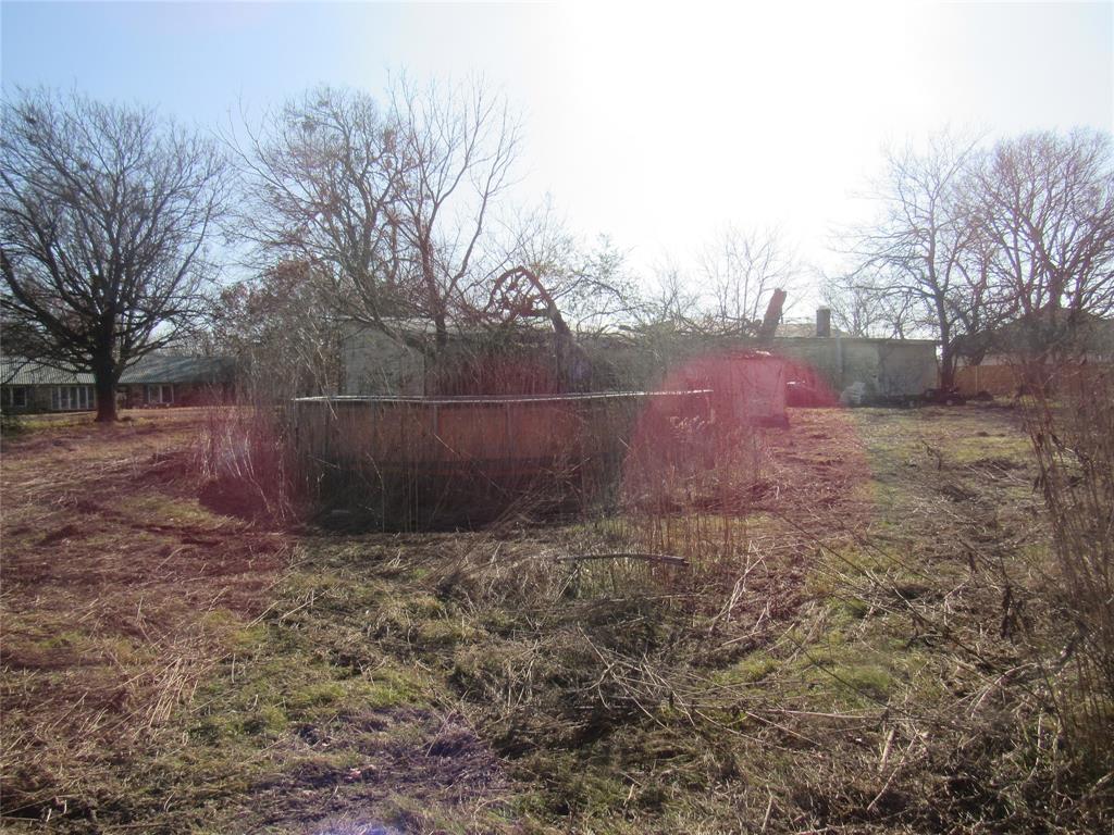 212 Wilson Street Bells, TX 75414 - Photo 3 of 7 a view of a backyard