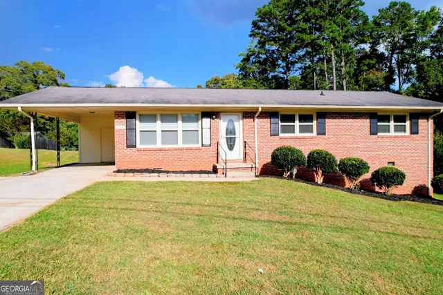front view of a house with a yard