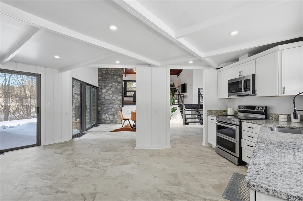 1081 Lowell Road Groton, MA 01450 - Photo 14 of 42 a view of a kitchen with furniture and windows