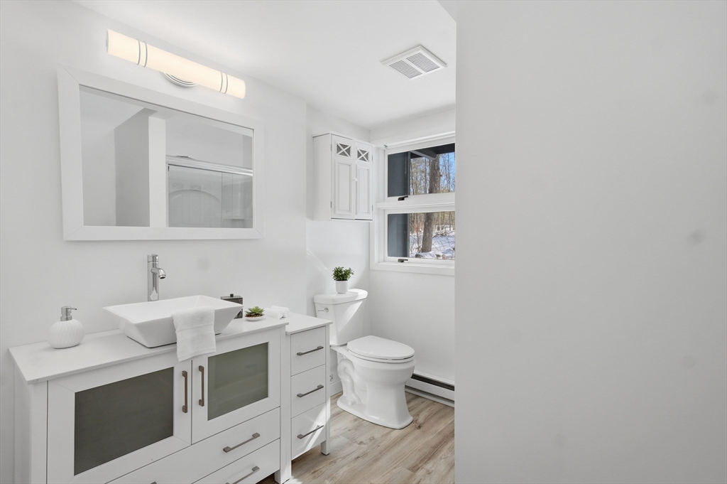 1081 Lowell Road Groton, MA 01450 - Photo 20 of 42 a bathroom with a sink and a toilet