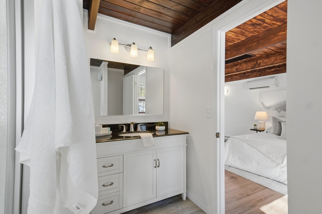 1081 Lowell Road Groton, MA 01450 - Photo 21 of 42 a bathroom with a sink and a mirror