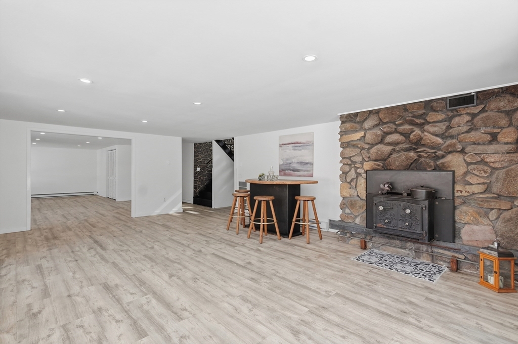 1081 Lowell Road Groton, MA 01450 - Photo 22 of 42 a view of livingroom with furniture and fireplace