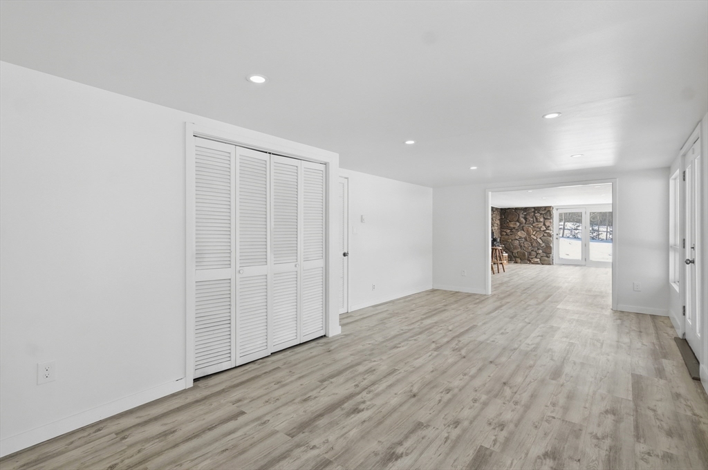 1081 Lowell Road Groton, MA 01450 - Photo 24 of 42 a view of an empty room with wooden floor