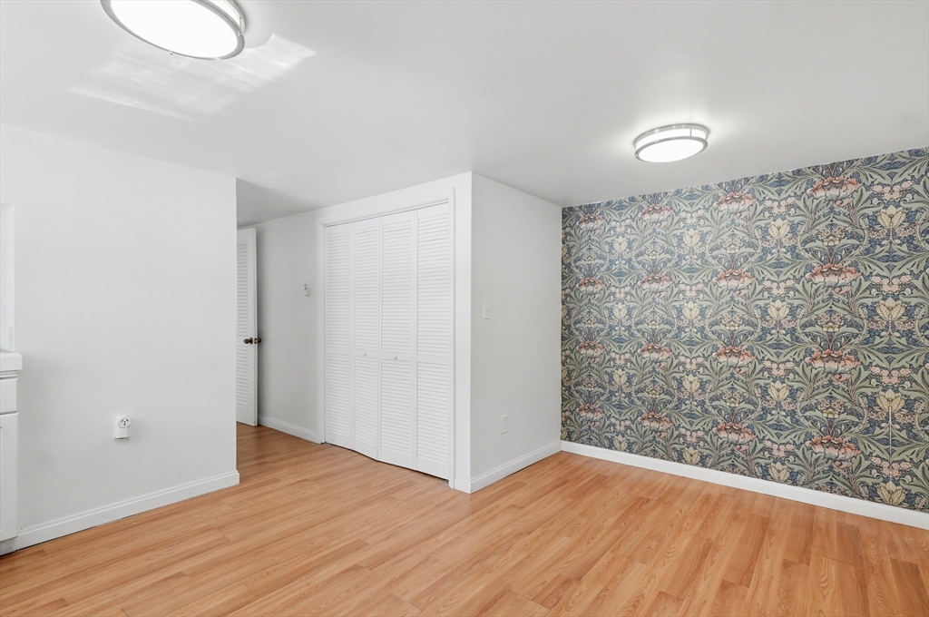1081 Lowell Road Groton, MA 01450 - Photo 26 of 42 a view of a livingroom with wooden floor