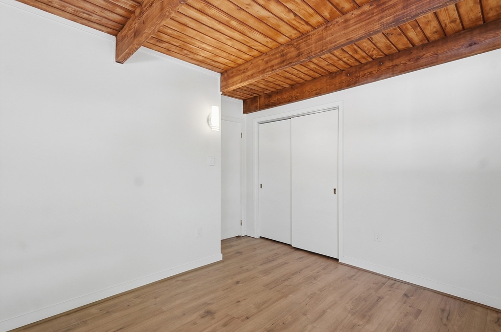 1081 Lowell Road Groton, MA 01450 - Photo 30 of 42 a view of a room with wooden floor