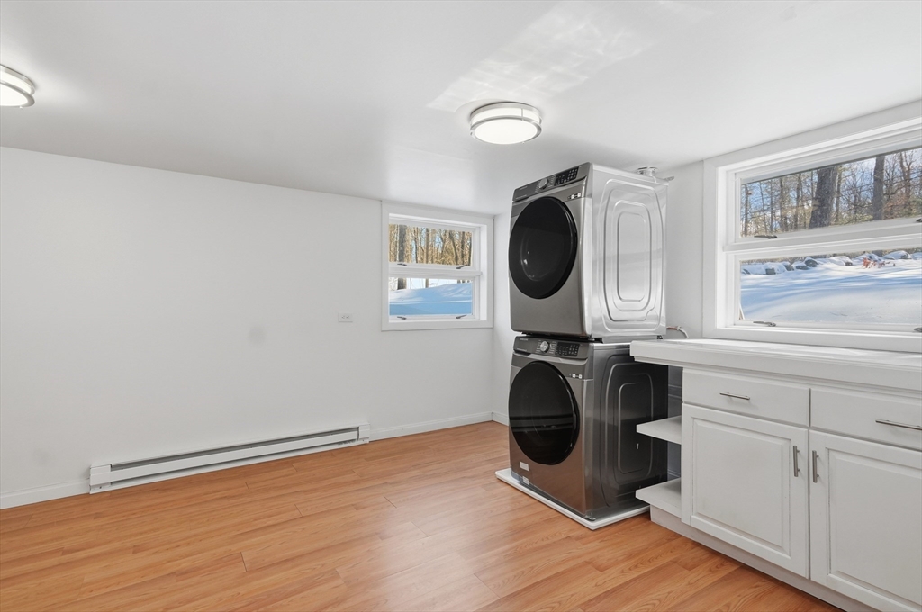 1081 Lowell Road Groton, MA 01450 - Photo 31 of 42 a kitchen with a refrigerator and a stove
