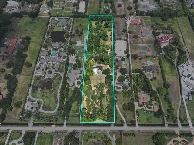 an aerial view of residential houses with city view