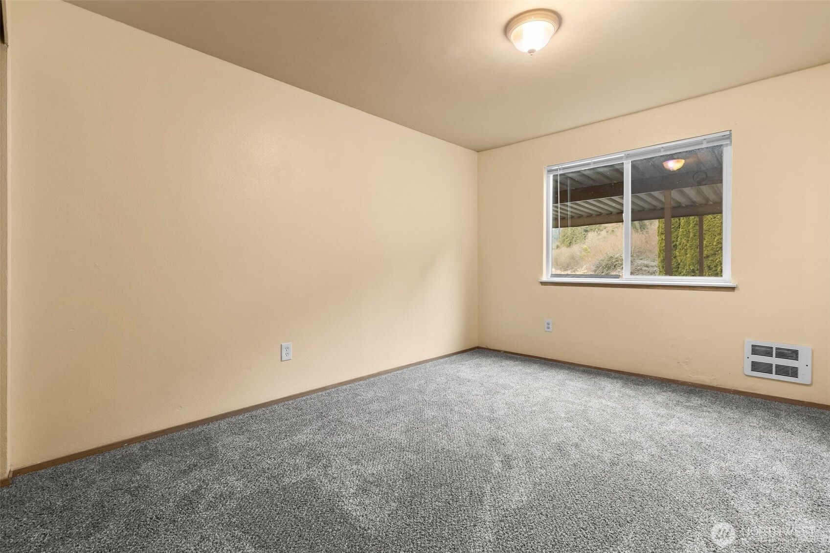 15912 Elm Street East Sumner, WA 98390 - Photo 16 of 30 an empty room with a window