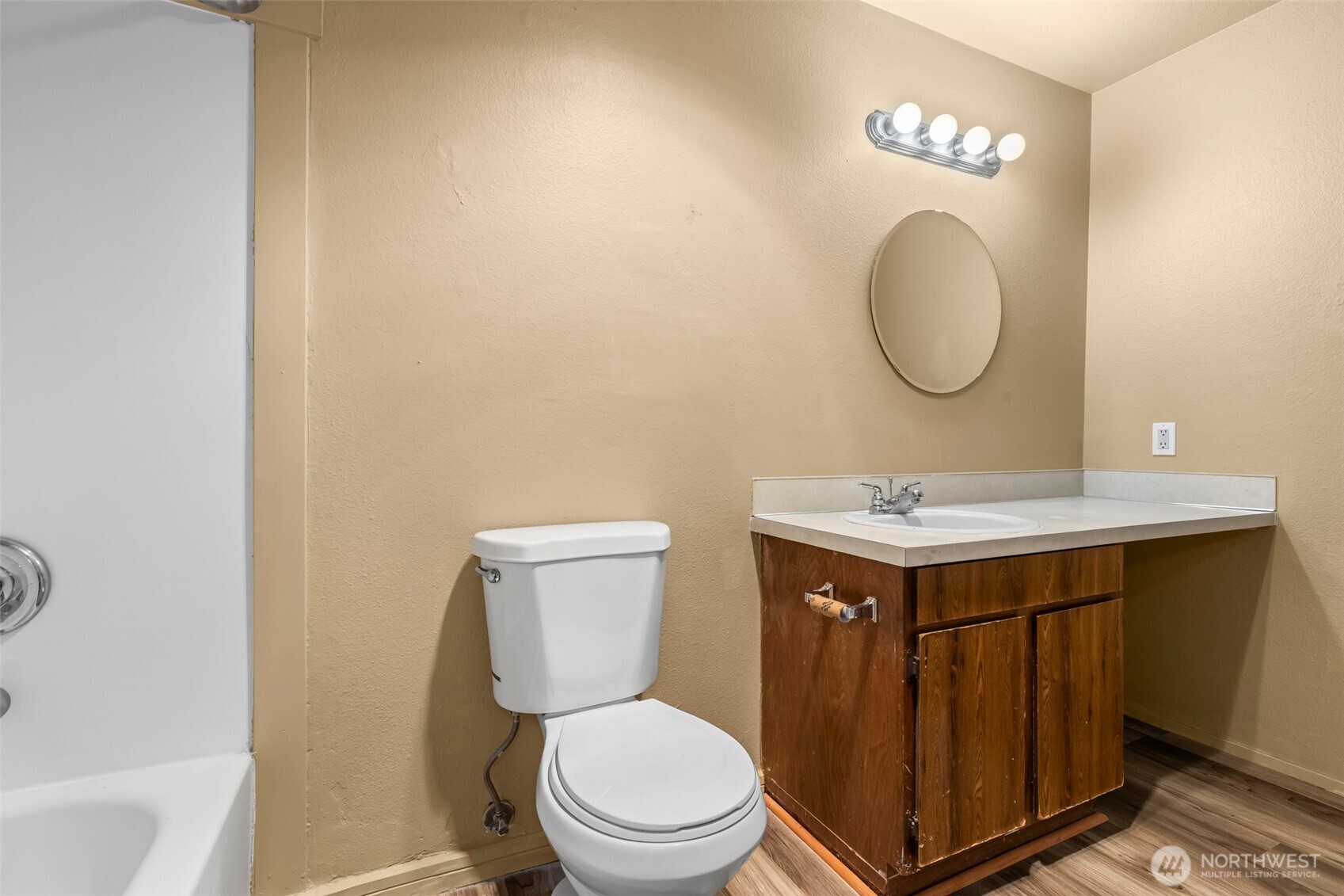 15912 Elm Street East Sumner, WA 98390 - Photo 21 of 30 a bathroom with a sink mirror vanity and toilet