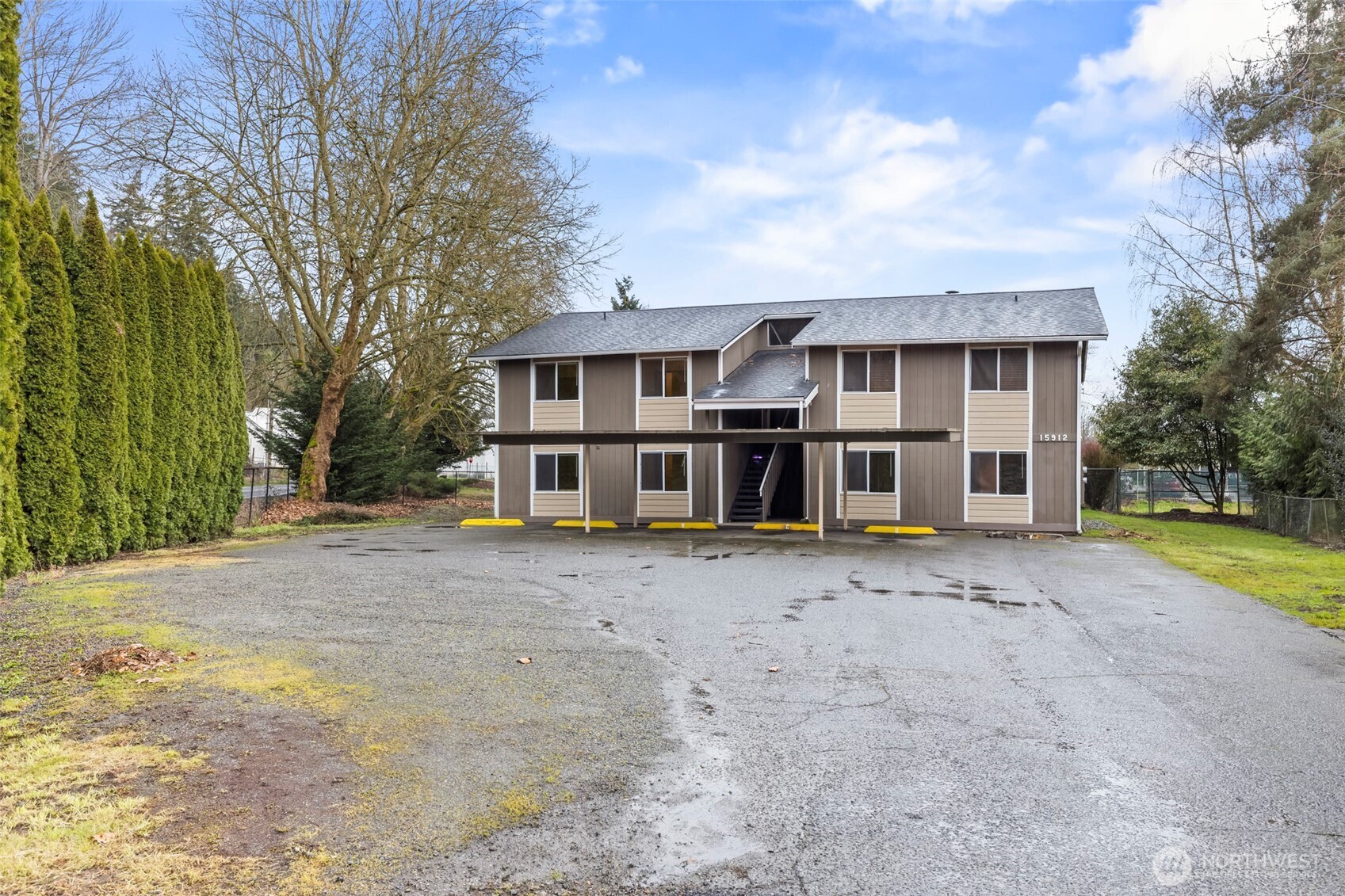 15912 Elm Street East Sumner, WA 98390 - Photo 27 of 30 a view of a house with a yard and large tree