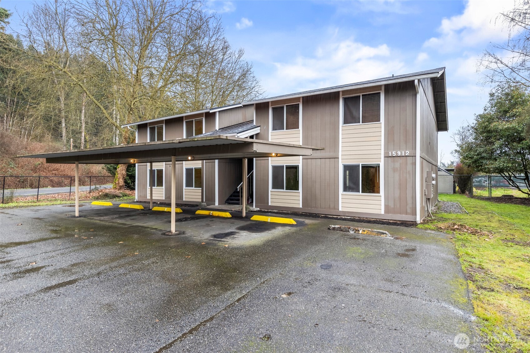 15912 Elm Street East Sumner, WA 98390 - Photo 28 of 30 a view of a house with a patio and a yard