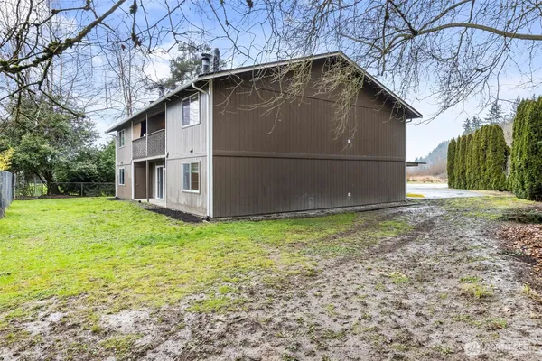 a house with trees in the background