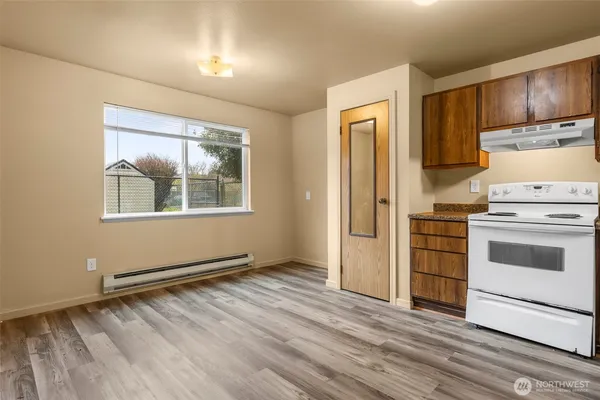 a kitchen with a stove and a refrigerator