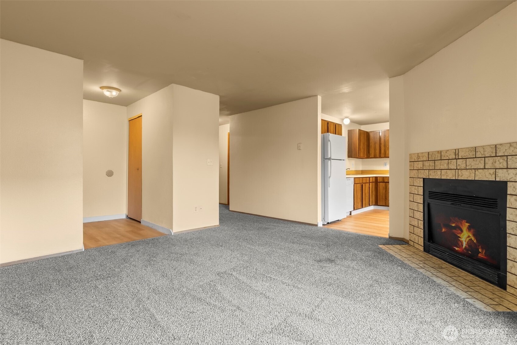 15912 Elm Street East Sumner, WA 98390 - Photo 7 of 30 a view of an empty room with a fireplace