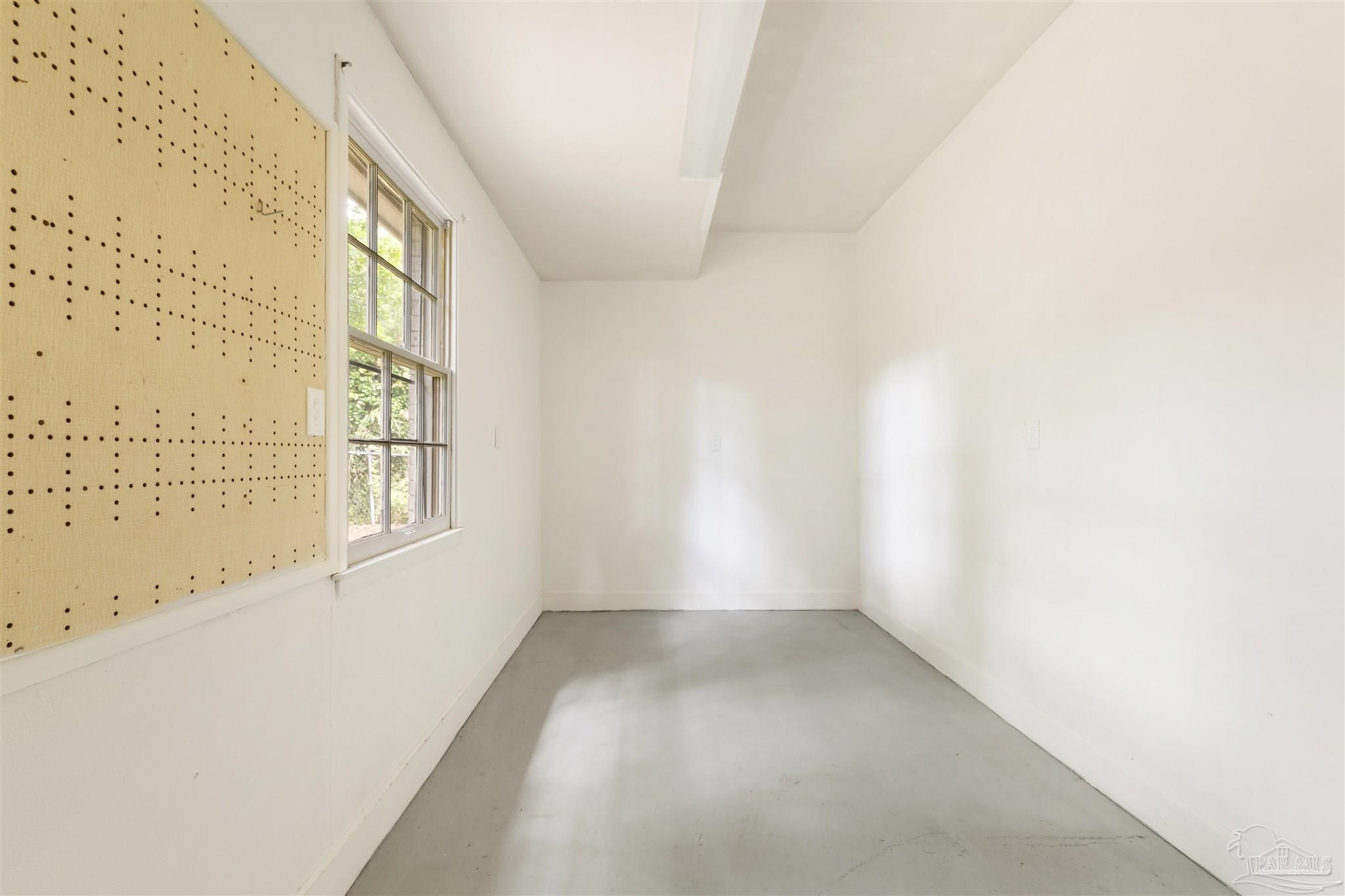 2045 Summit Boulevard Pensacola, FL 32503 - Photo 18 of 23 a view of an empty room with a window