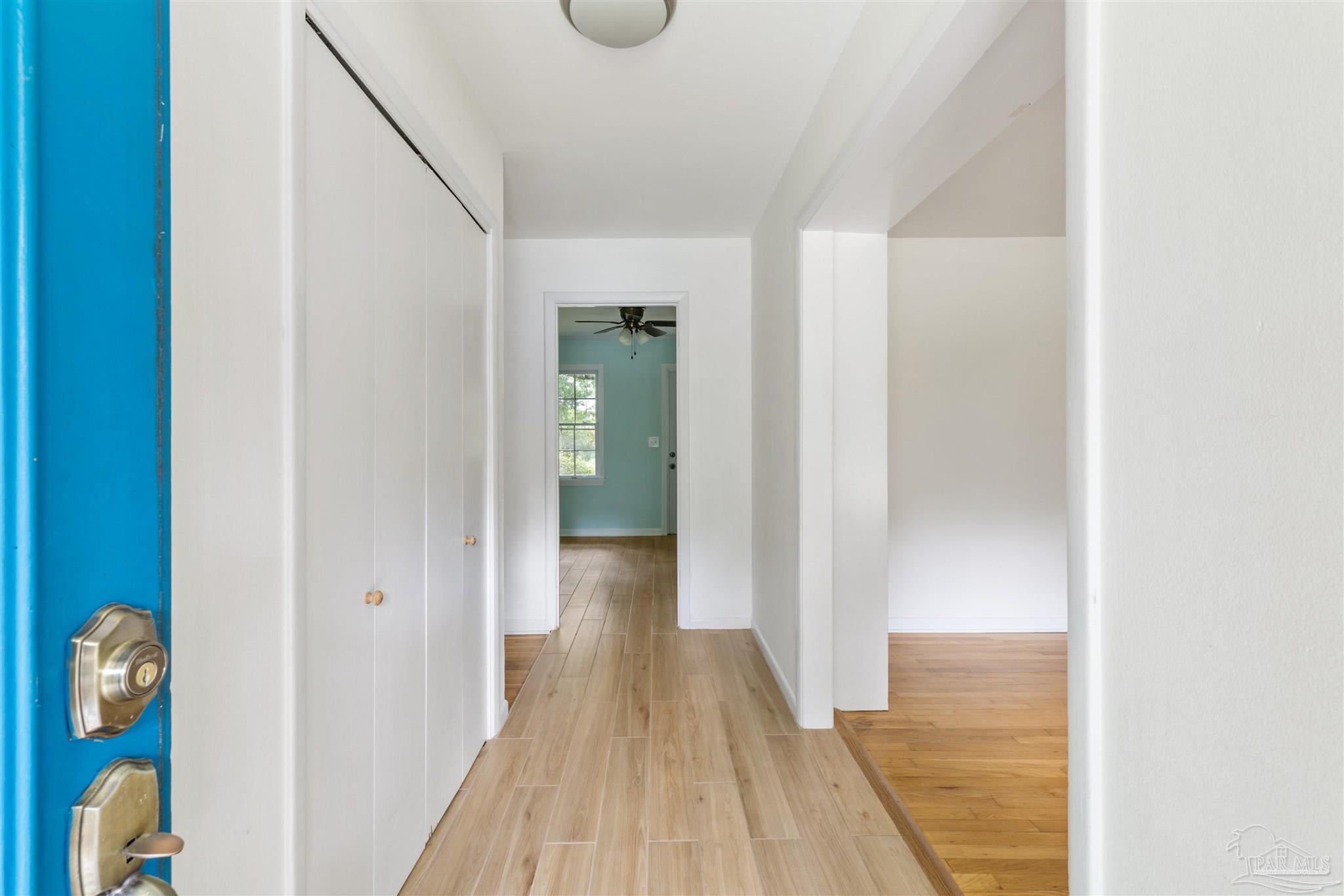 2045 Summit Boulevard Pensacola, FL 32503 - Photo 2 of 23 a view of a hallway with wooden floor