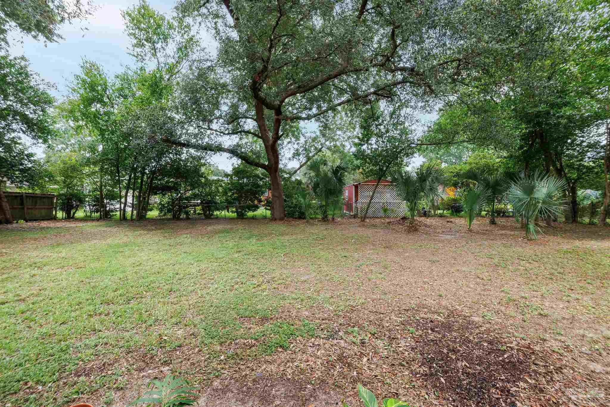2045 Summit Boulevard Pensacola, FL 32503 - Photo 22 of 23 a view of a outdoor space with deck and trees