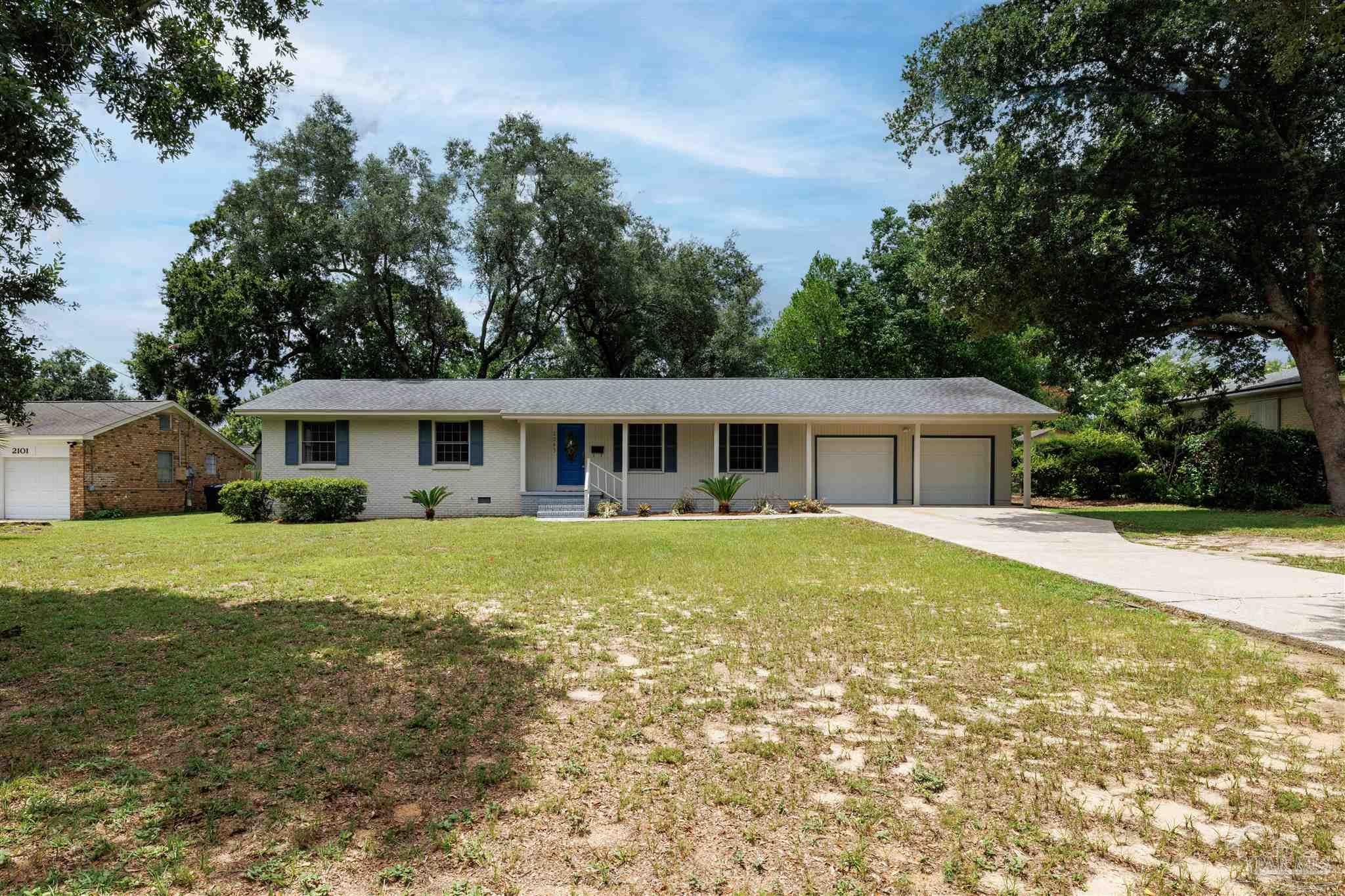 2045 Summit Boulevard Pensacola, FL 32503 - Photo 23 of 23 a front view of a house with a garden
