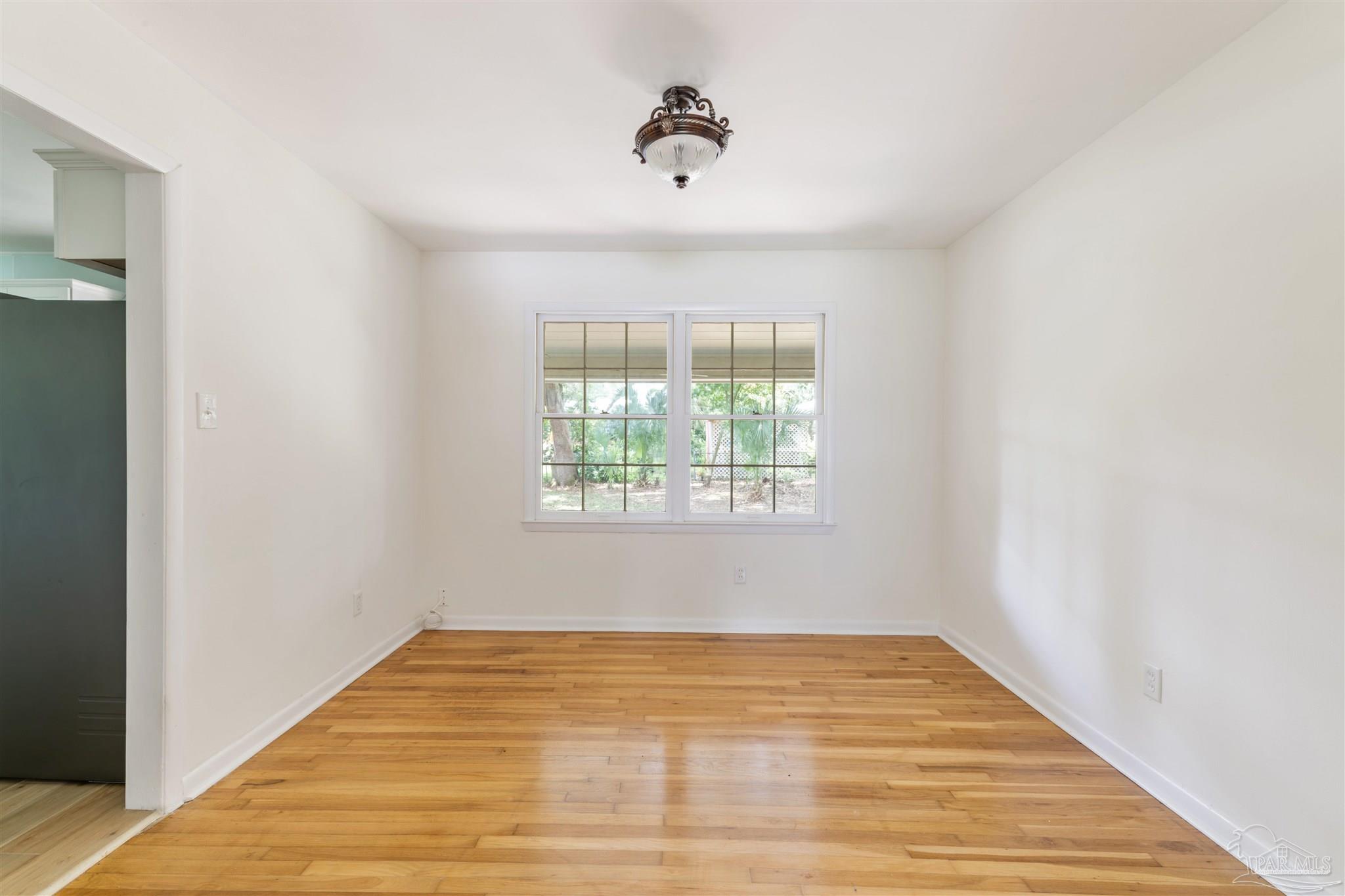 2045 Summit Boulevard Pensacola, FL 32503 - Photo 10 of 23 a view of empty room with wooden floor and fan