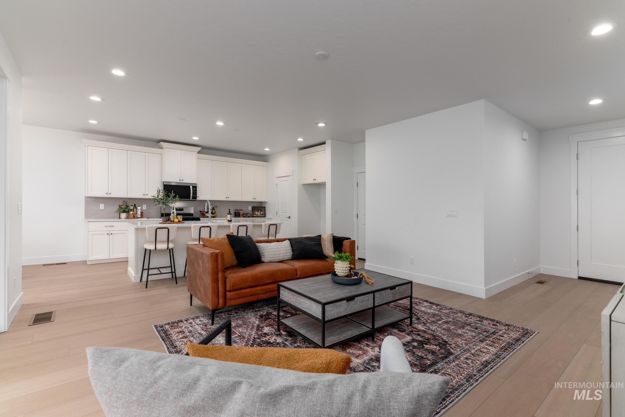 1907 West Blue Lightning Street Middleton, ID 83644 - Photo 3 of 11 Living area with recessed lighting and light wood-type flooring