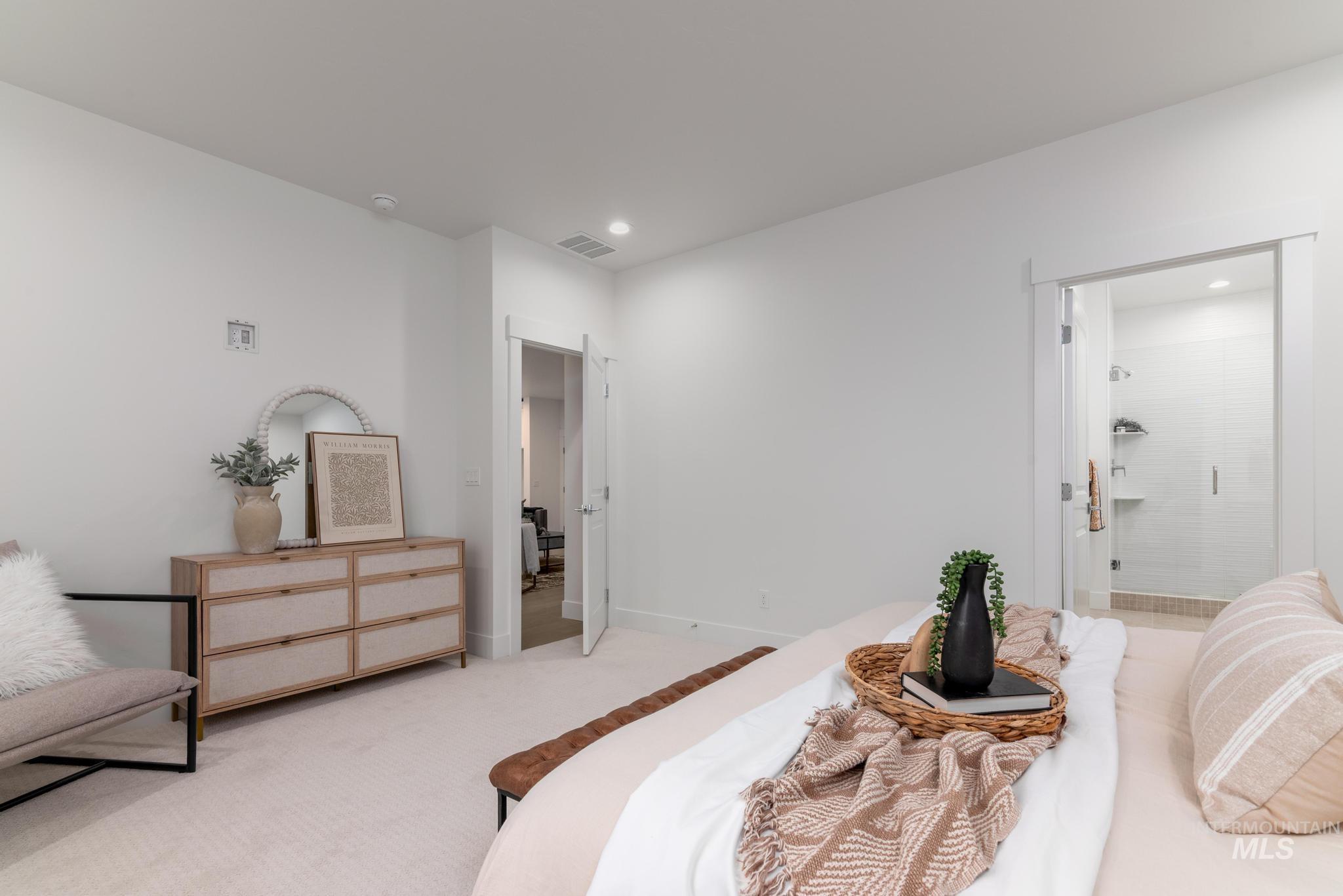 1907 West Blue Lightning Street Middleton, ID 83644 - Photo 8 of 11 Bedroom with light colored carpet and connected bathroom