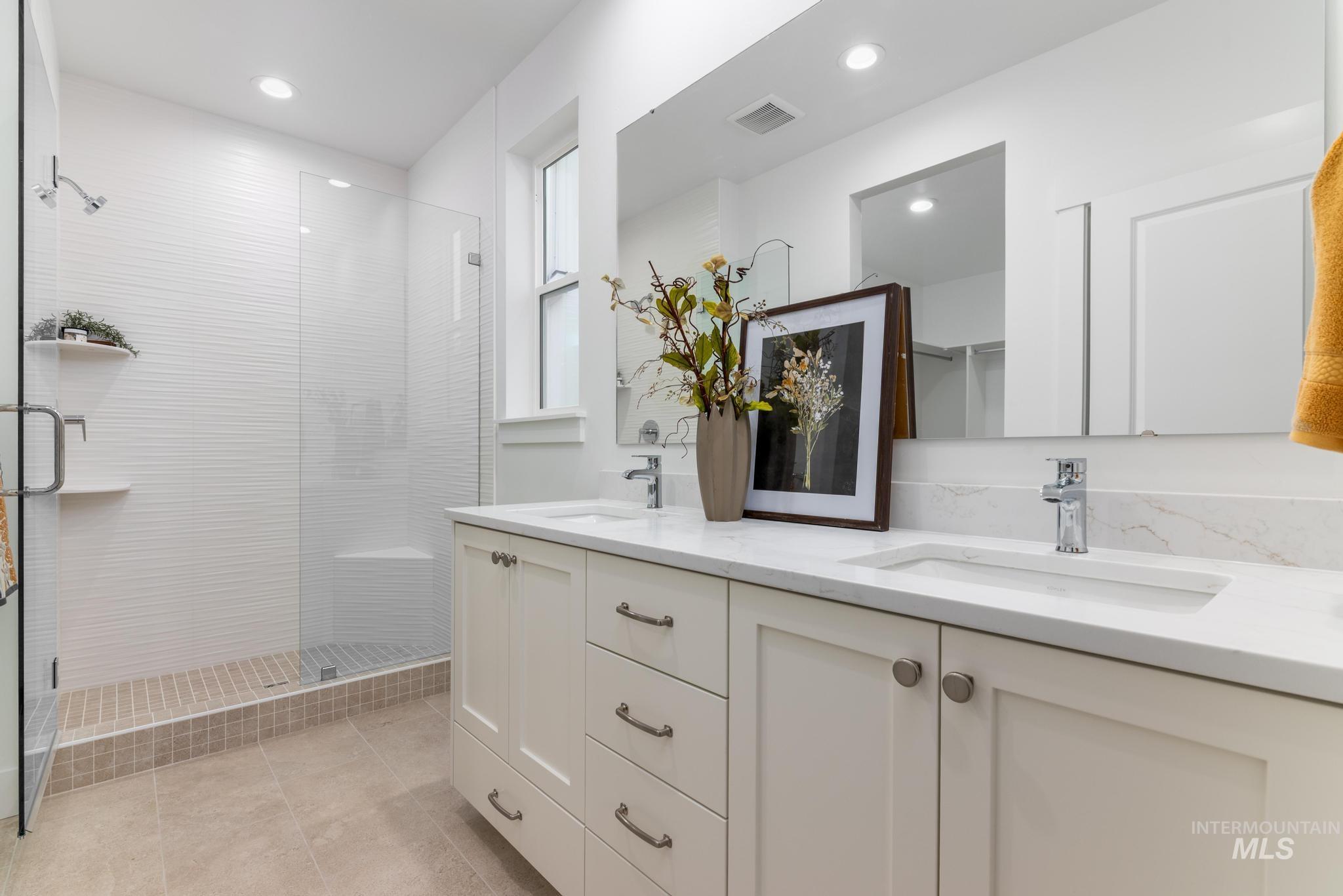 1907 West Blue Lightning Street Middleton, ID 83644 - Photo 9 of 11 Full bath featuring double vanity, a shower stall, and recessed lighting