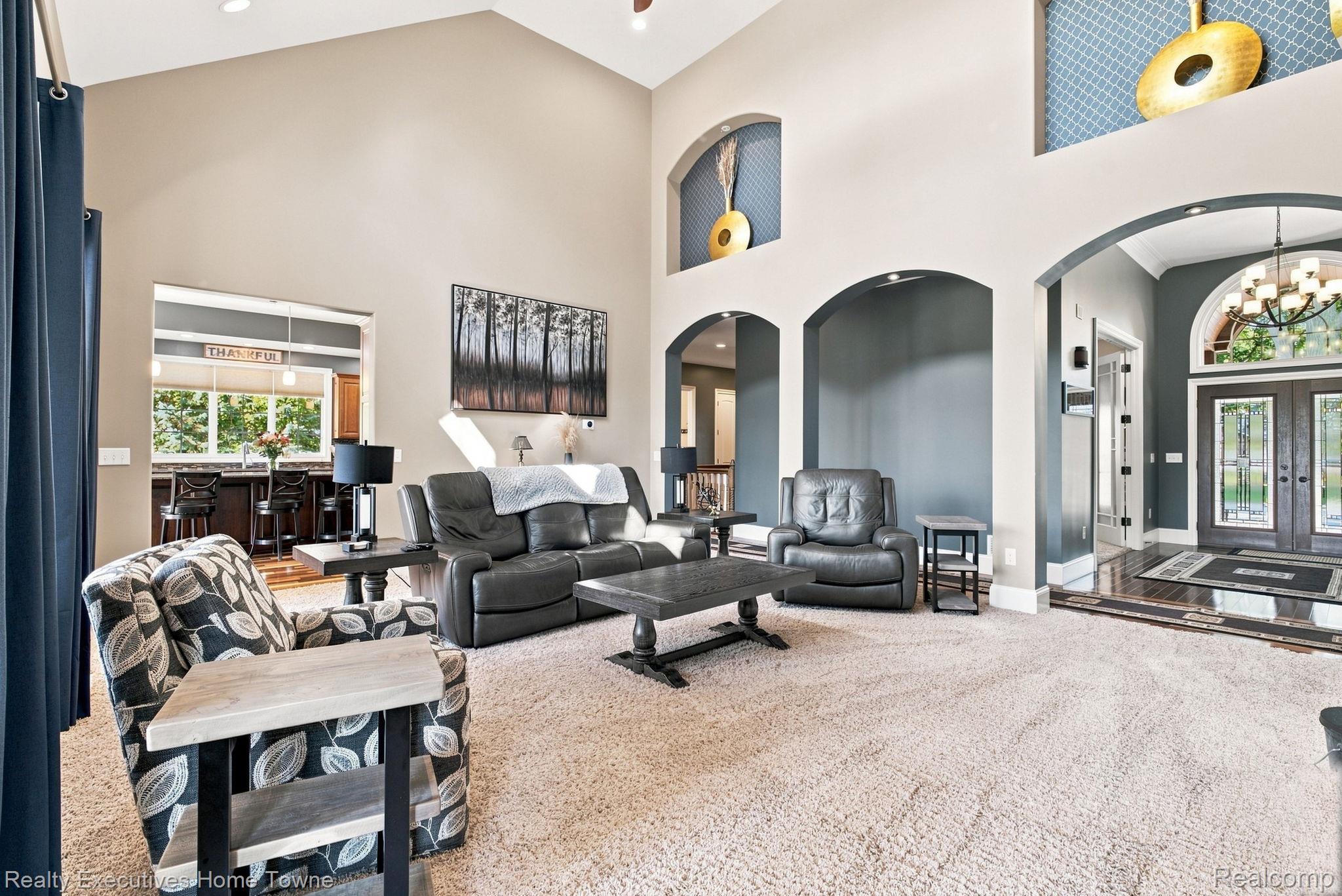 2829 Riverside Drive Port Huron, MI 48060 - Photo 25 of 99 Vaulted ceilings with recessed lighting, arched doorways, a large entry with double doors, and wood-finish flooring accents