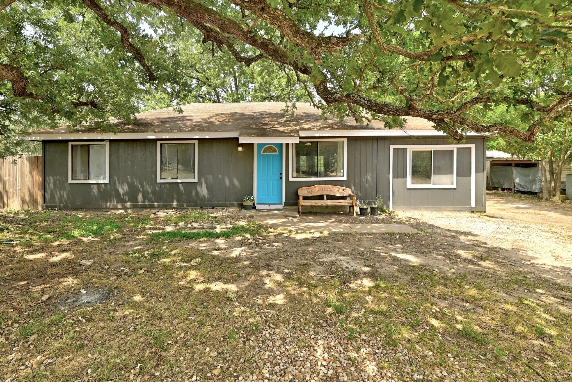 136 Shadow Oak Drive Bastrop, TX 78602 - Photo 1 of 1 Ranch-style home featuring a shingled roof