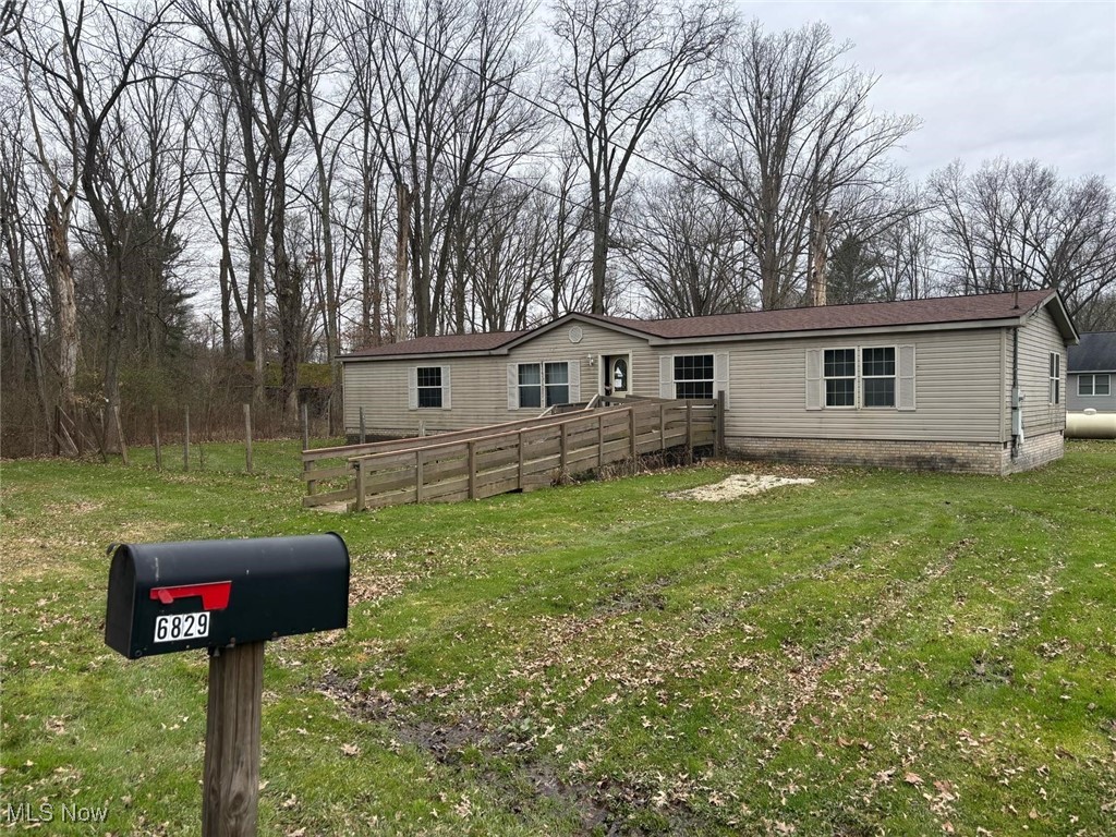 6829 Lee Road Newton Falls, OH 44444 - Photo 1 of 10 Manufactured / mobile home featuring a front yard