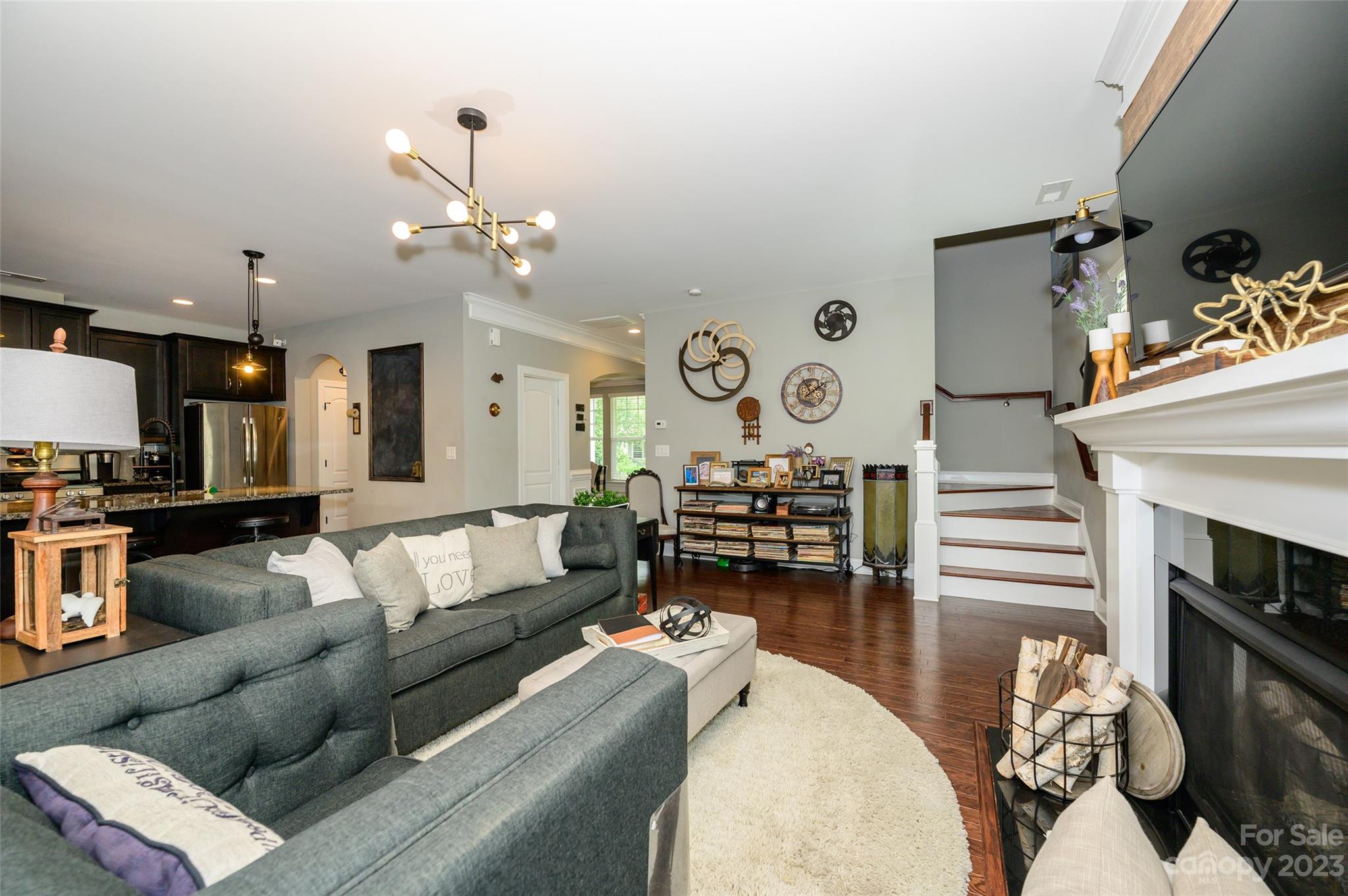 3317 Lucy Drive Monroe, NC 28110 - Photo 13 of 38 a living room with furniture and a fireplace