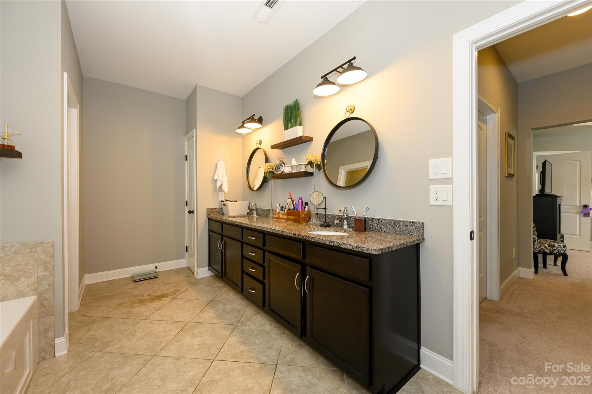3317 Lucy Drive Monroe, NC 28110 - Photo 23 of 38 a bathroom with a sink and a mirror