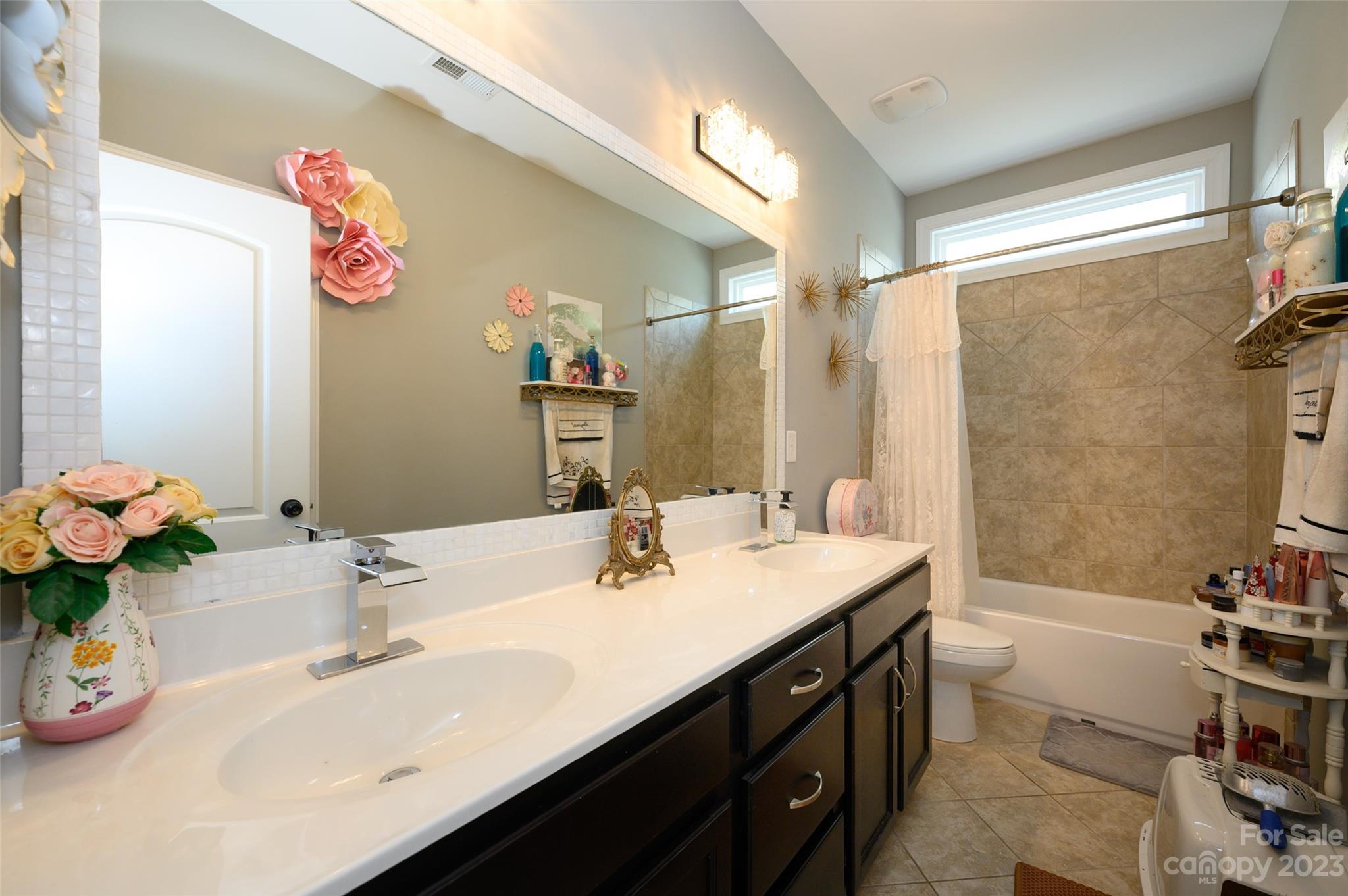 3317 Lucy Drive Monroe, NC 28110 - Photo 26 of 38 a bathroom with a sink double vanity and a tub