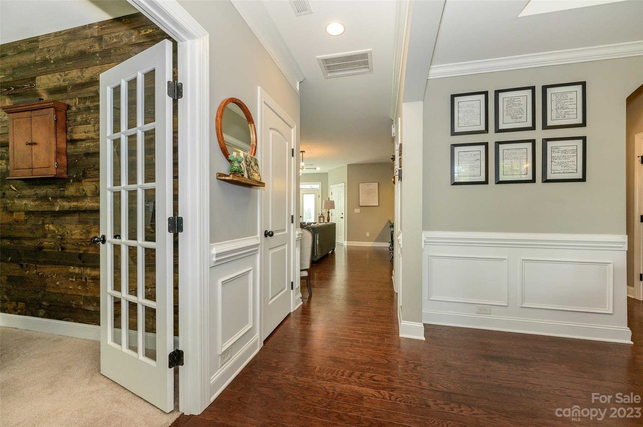 3317 Lucy Drive Monroe, NC 28110 - Photo 4 of 38 a view of a hallway with wooden floor and staircase