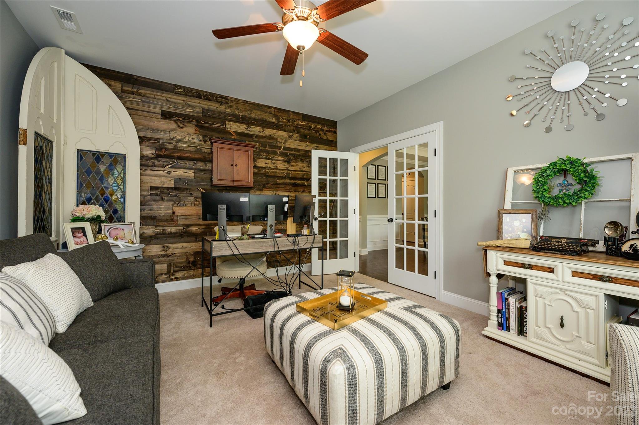 3317 Lucy Drive Monroe, NC 28110 - Photo 7 of 38 a bed room with a bed and a chandelier