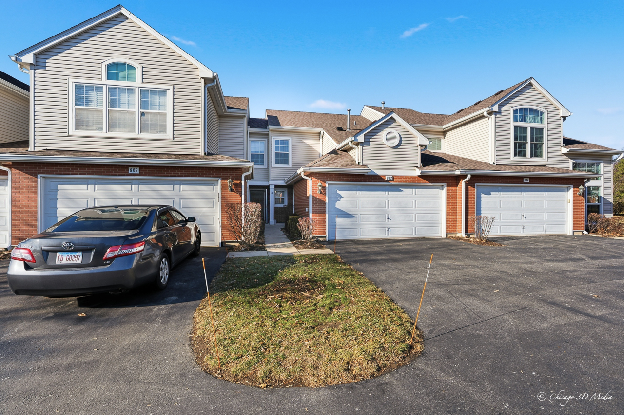 812 Old Checker Road Buffalo Grove, IL 60089 - Photo 22 of 26 front view of a house with a parking space
