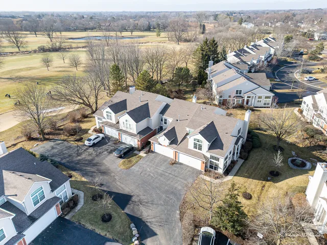 an aerial view of a house with lake view