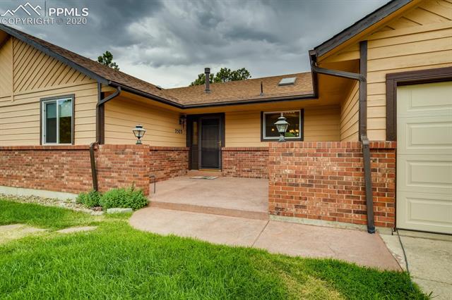7575 Tobin Road Colorado Springs, CO 80908 - Photo 2 of 27 Large patio area into front entry of the home
