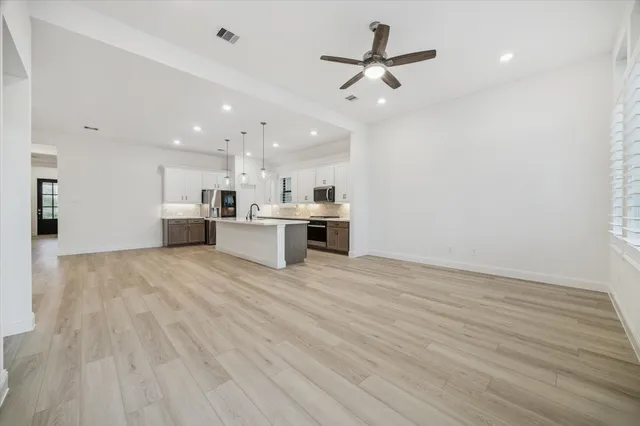 a view of a kitchen with a sink and a stove