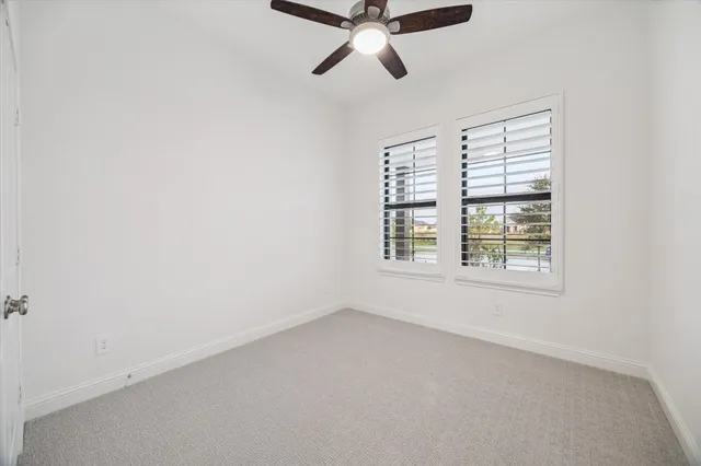 a view of an empty room with closet