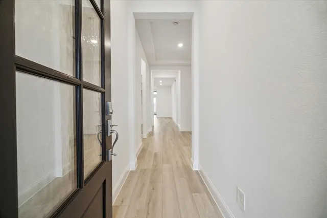 a view of a bathroom from the hallway