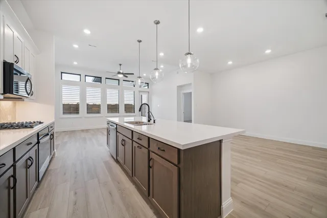 a kitchen with a stove and a sink