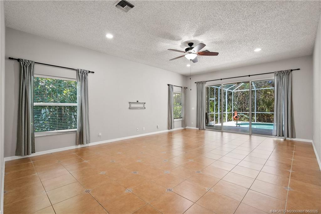 7221 Southeast Seagate Lane Stuart, FL 34997 - Photo 13 of 51 a view of an empty room with a window