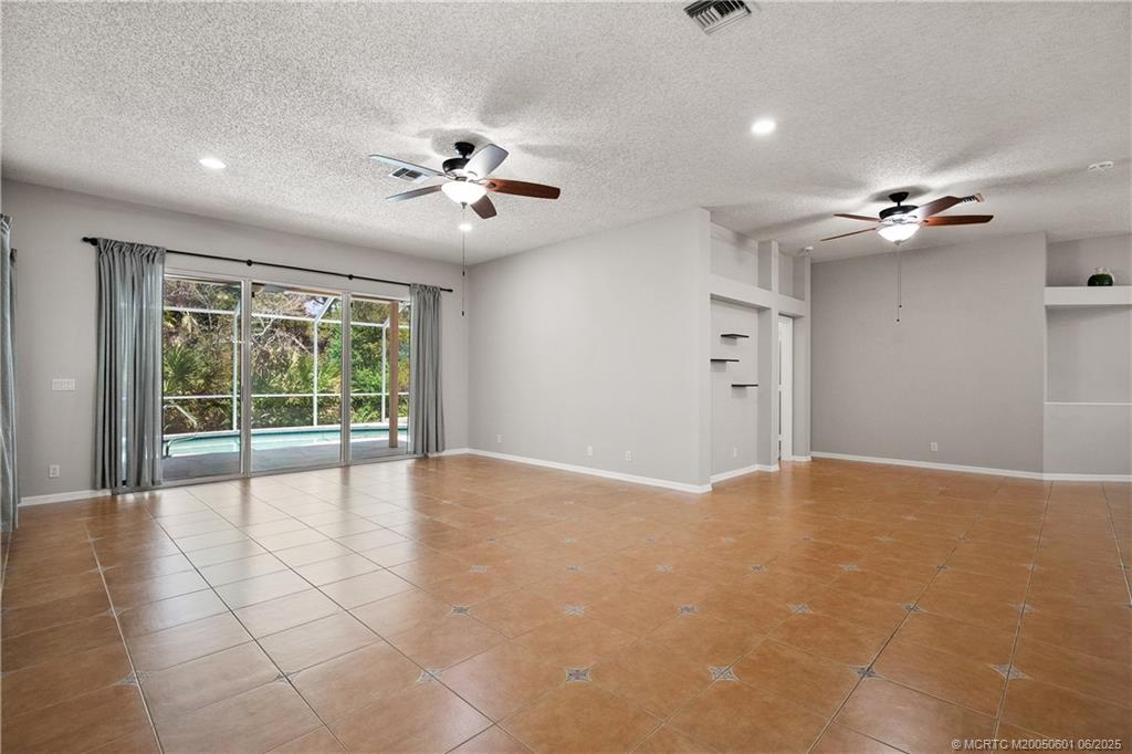 7221 Southeast Seagate Lane Stuart, FL 34997 - Photo 14 of 51 a view of an empty room with a window