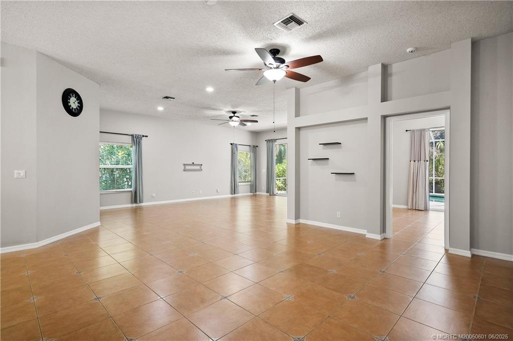 7221 Southeast Seagate Lane Stuart, FL 34997 - Photo 18 of 51 a view of an empty room with a window