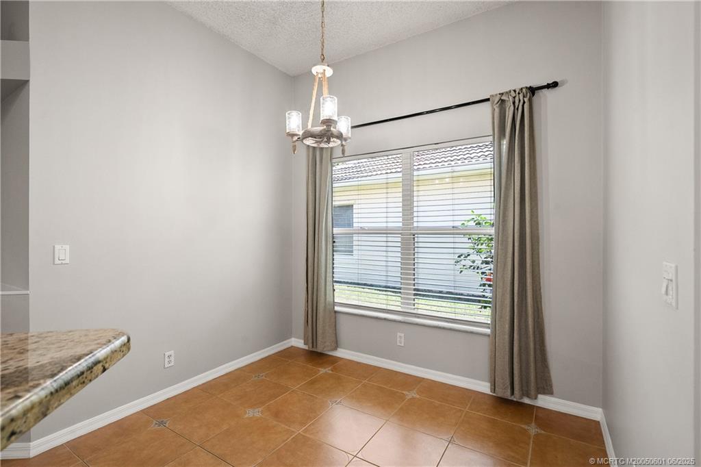 7221 Southeast Seagate Lane Stuart, FL 34997 - Photo 24 of 51 a view of an empty room with a window