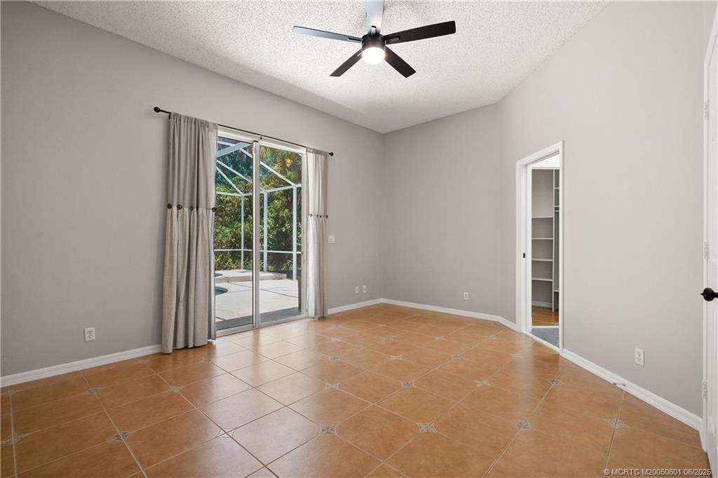 7221 Southeast Seagate Lane Stuart, FL 34997 - Photo 27 of 51 a view of an empty room with a window