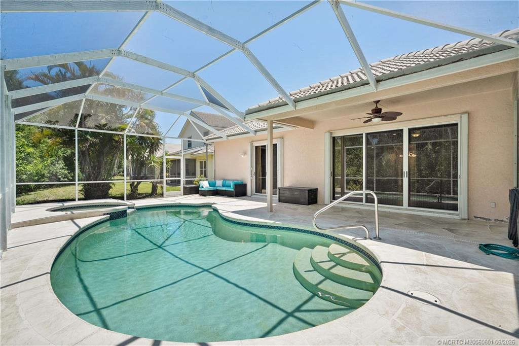 7221 Southeast Seagate Lane Stuart, FL 34997 - Photo 36 of 51 a view of a swimming pool with outdoor seating